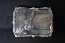 A Scottish Victorian silver salver, of rectangular form having a moulded rim with floral scroll