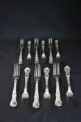 A cased set of George IV silver flatware, containing six Coburg pattern fork with 'P-T' initials