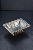An Elizabeth II silver pedestal bonbon dish, of rectangular form having a lobed rim with floral