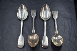 A set of four George IV silver fiddle pattern spoons, having heraldic crests to terminals, marks for