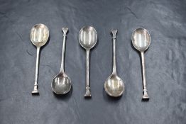 A cased set of five silver teaspoons, replicas of an early Stuart and Commonwealth period having '