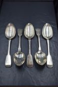 A group of five William IV silver fiddle pattern serving spoons, having 'P' initial to terminals,