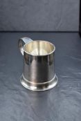 An Elizabeth II silver tankard, of traditional form having a moulded rim and s-curve handle, with