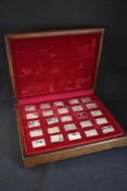 A wooden cased set of twenty-five 'Elizabeth Our Queen' silver ingots, depicting the reign of