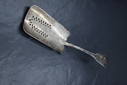A George III silver fiddle pattern fish slice/server, having decorative engraving to the slice,