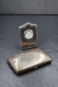 A George V silver cigar case, of hinged rectangular form, curved for the pocket with a monogram to