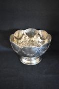 A late Edward VII silver rose bowl of traditional form, having a lobed rim with floral swags,