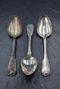 A group of three Scottish George III silver fiddle and shell pattern serving spoons, having 'TR'