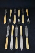 A set of ten George V silver fish forks and knives, having imitation ivory handles, marks for
