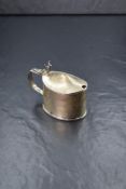 A Victorian silver mustard, of oval form having moulded rim with horn motif top, with blue glass