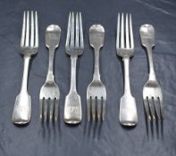 A set of six William IV silver fiddle pattern forks, having heraldic crests to terminals, marks