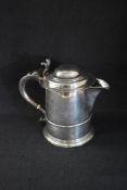 A Queen Anne silver tankard later conversion to a jug, of traditional form having a moulded lid,