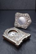 An Edwardian silver mounted wooden pocket watch frame, of rectangular form having scroll