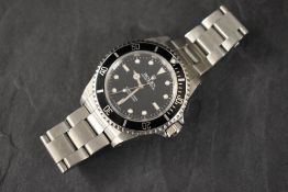 A Rolex Oyster Perpetual Submariner wristwatch, the black dial having baton and dot numerals, on a