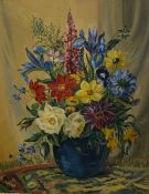 W.L Potter (20th Century) Oil on canvas, a still life of a vibrant bouquet of flowers in a blue