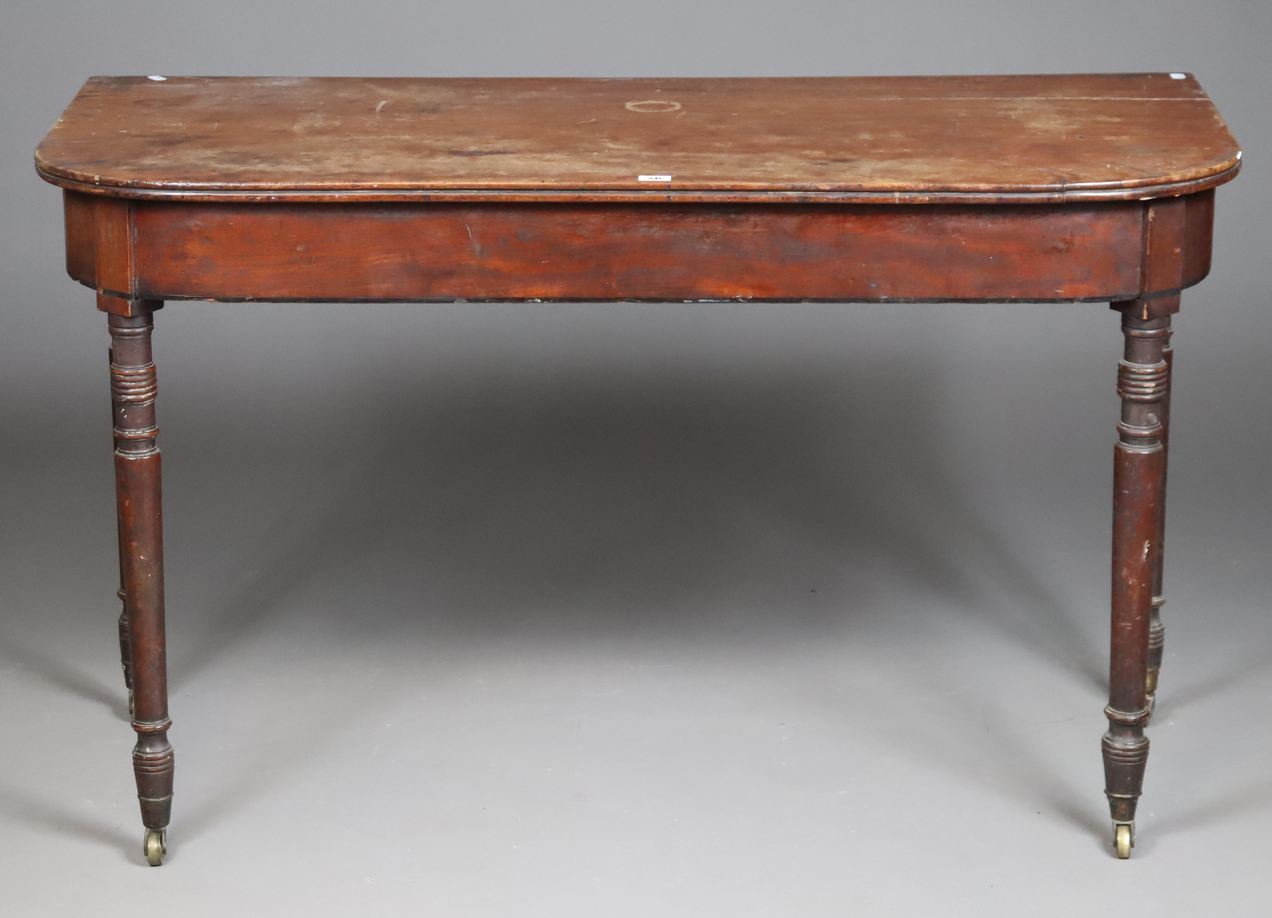 A 19th century mahogany side table with rounded front corners to the rectangular top, & on four