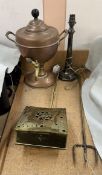A copper samovar together with an electroplated lamp base,