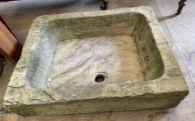 A stone sink of rectangular form,
