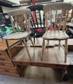 A pine side table with a rectangular top above a pair of drawers on turned legs together with two