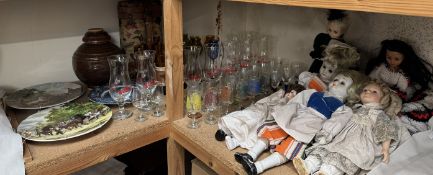 A collection of modern dolls together with drinking glasses,