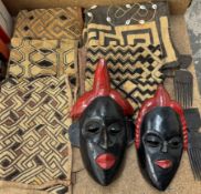 Kuba raffia squares together with African tribal masks and combs