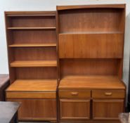 A William Lawrence teak wall unit with drop down front,