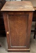 A Victorian mahogany pot cupboard with a square top above a single door and plinth base