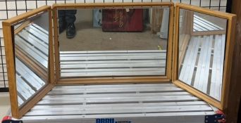 A modern tryptych dressing table mirror