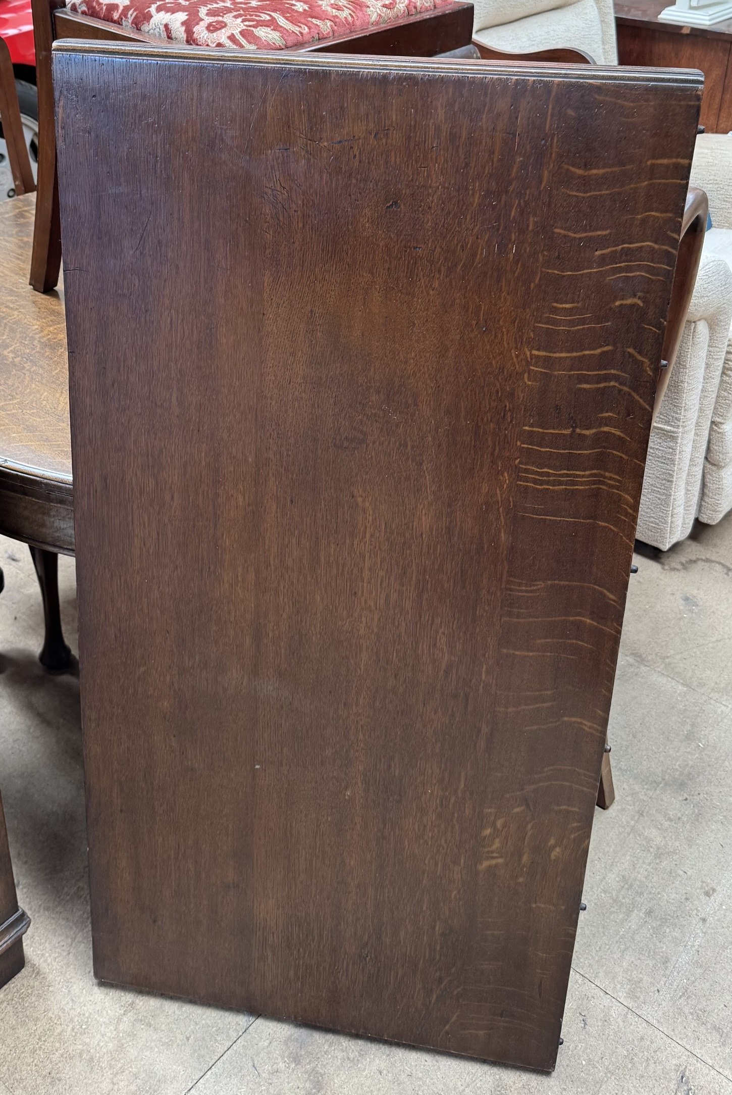 An early 20th century oak extending dining table of circular form with an additional leaf together - Image 2 of 2