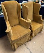 A 19th century upholstered wing back arm chair together with a similarly upholstered smaller