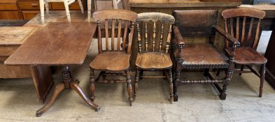 A 19th century mahogany tripod table with a rectangular top on a turned column and three legs