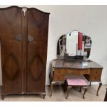 A 20th century walnut part bedroom suite comprising a wardrobe,