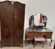 A 20th century walnut part bedroom suite comprising a wardrobe,
