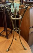 A brass jardiniere stand, with turned finials,