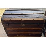 A trunk with a domed top and planked sides
