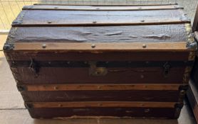 A trunk with a domed top and planked sides