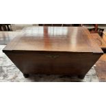 A 19th century mahogany coal box of sarcophagus form with lions head handles on ball feet,