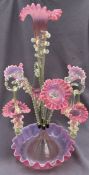 A pink and lemon glass epergne with a central trumpet three further trumpets,