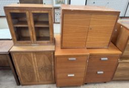 A 20th century walnut side cabinet with a glazed top and cupboard base together with two filing