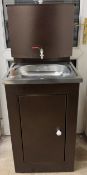 A freestanding sink,