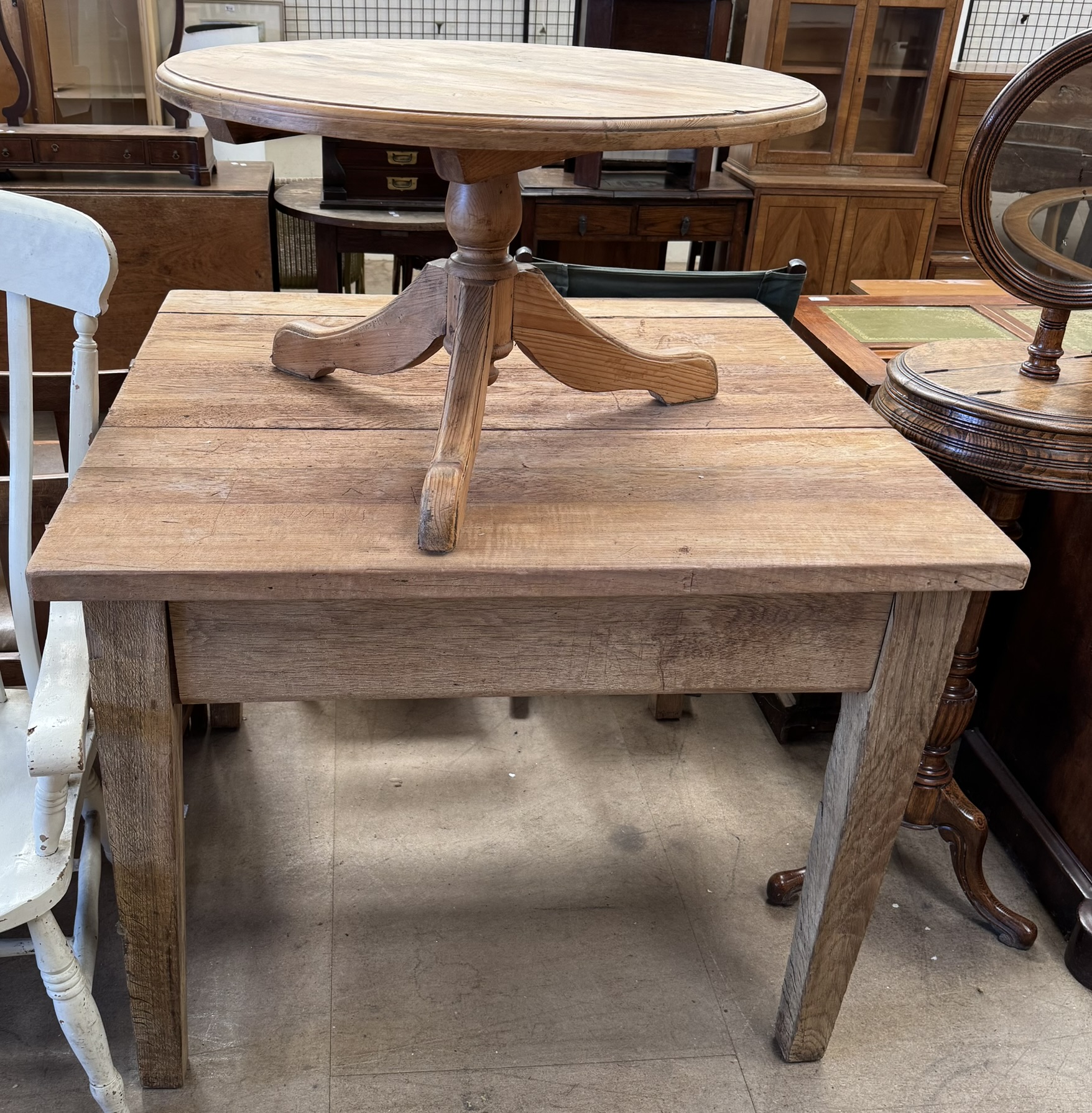 An oak table of square form, with a planked top and square tapering legs, 106.5cm x 106.5cm x 86.