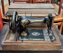 A Singer sewing machine in a case