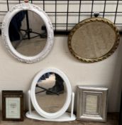 A circular gilt framed wall mirror together with an oval wall mirror,