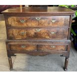 An 18th century and later oak and walnut chest on stand with a rectangular top above two long