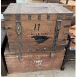 A metal bound trunk with hasp locks together with another trunk