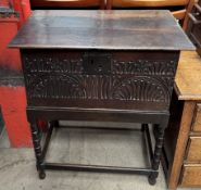 An 18th century and later oak bible box with a hinged planked top,