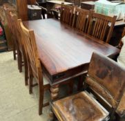 A 20th century hardwood dining table and six chairs