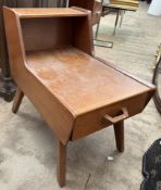 A Mid 20th century G-Plan teak telephone / sewing box with a drawer and slide on splayed legs