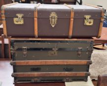 A canvas and metal mounted trunk together with another trunk