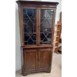 A 19th century oak and mahogany standing corner cupboard,